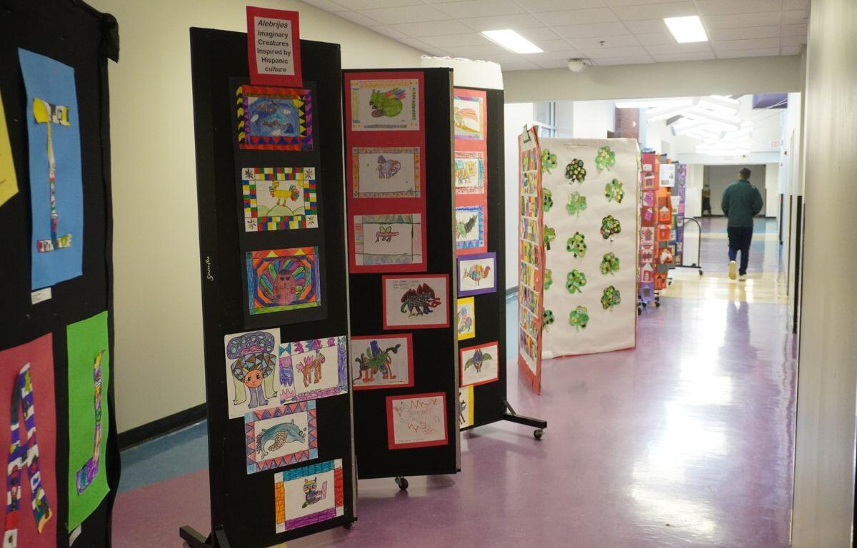A display of student artwork reflecting diverse cultures.