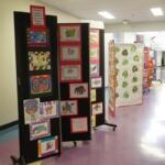 A display of student artwork reflecting diverse cultures.