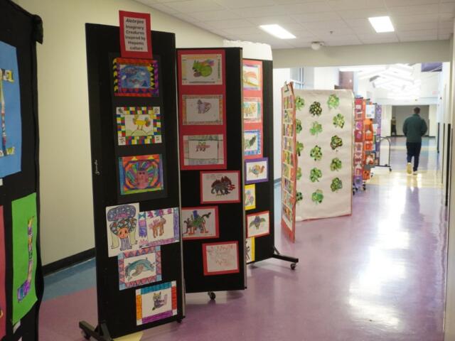 A display of student artwork reflecting diverse cultures.
