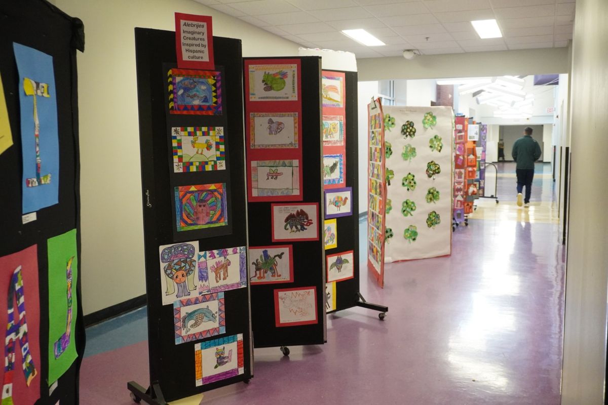 A display of student artwork reflecting diverse cultures.