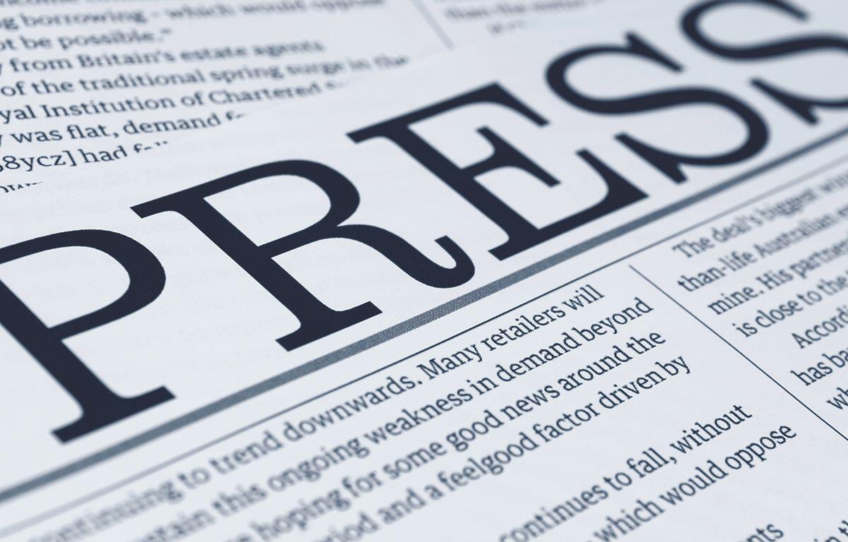 Press on a newspaper