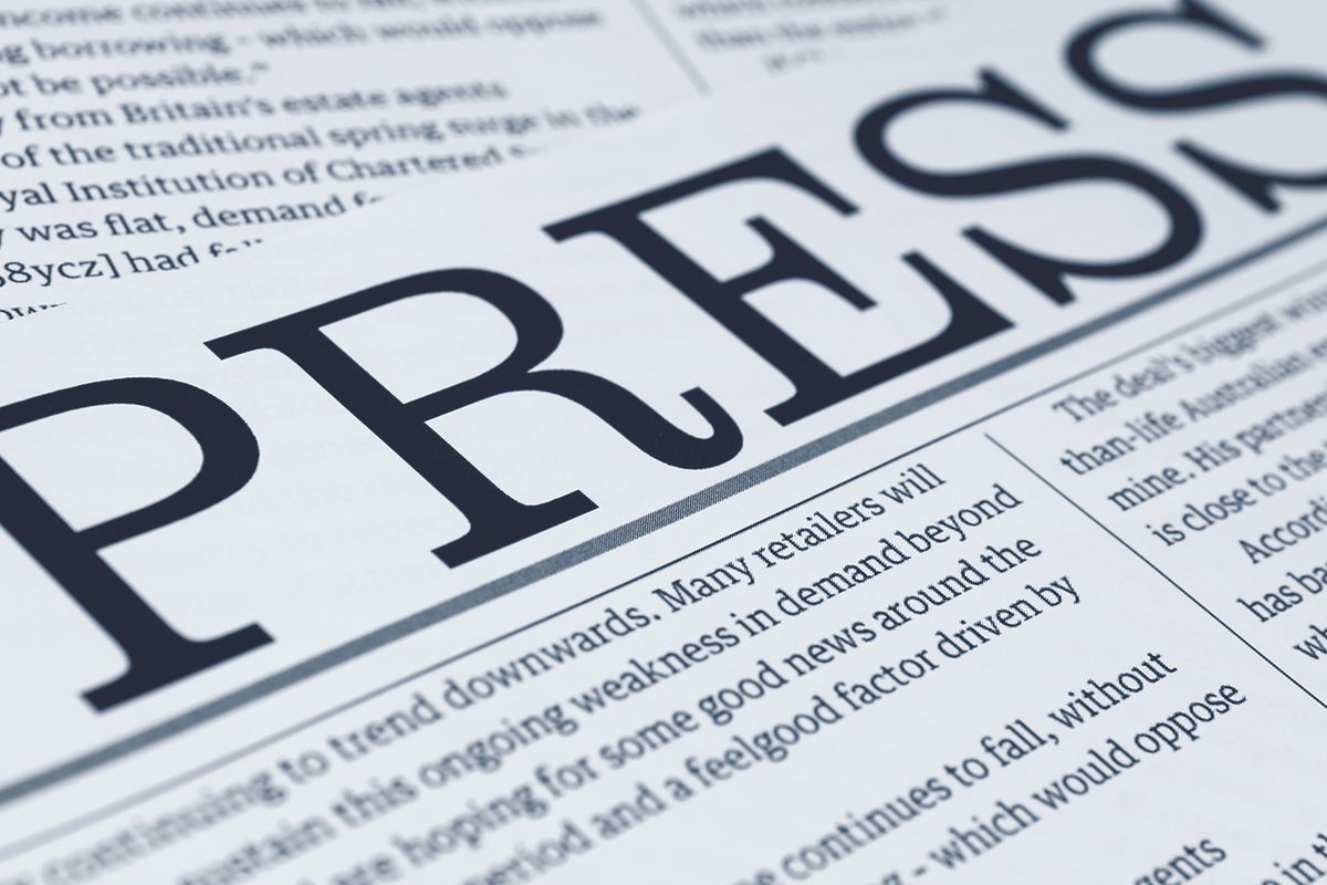 Press on a newspaper