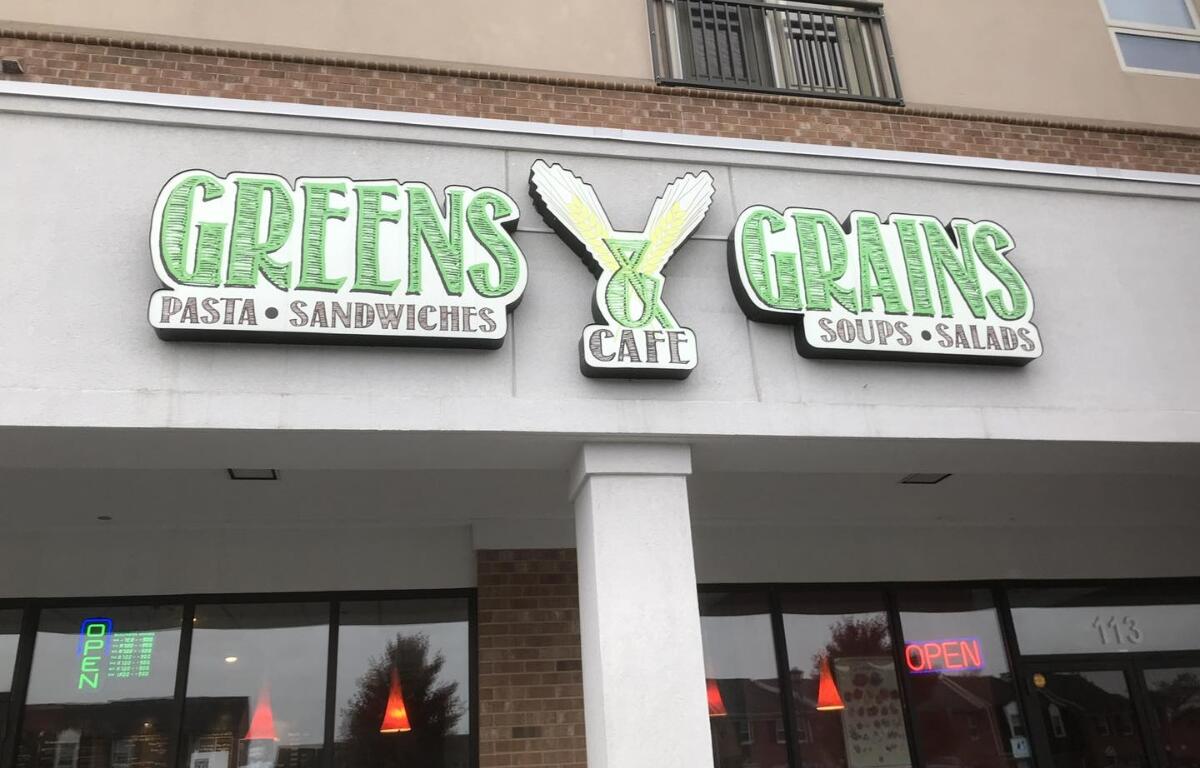 greens & grains sign