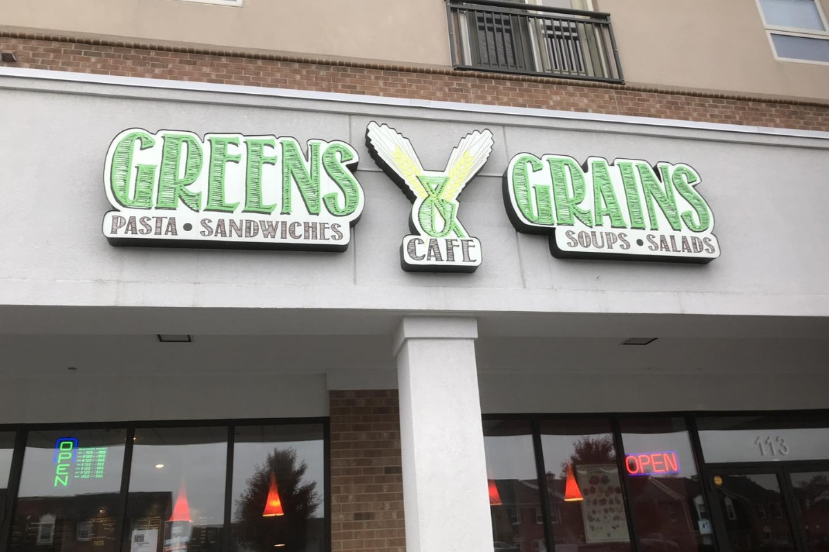 greens & grains sign