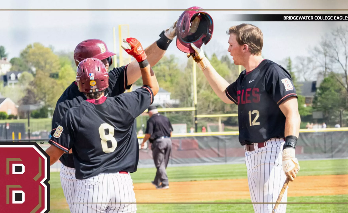 Baseball players in black jerseys celebrate with a high-five on the field, Bridgewater College Eagles logo visible in the scene.