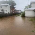 Photo of flood water along residence on E. Elizabeth St.