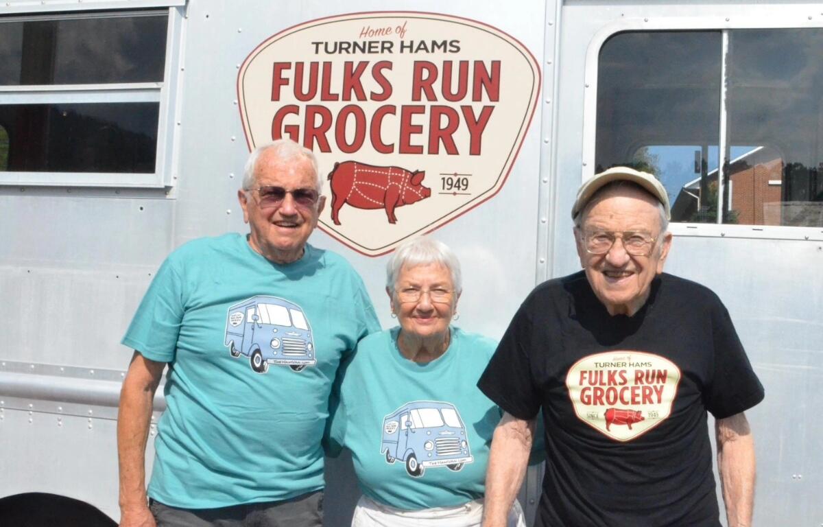Miles, Marcella, and Miles' brother Garnett (original owner of Fulks Run Grocery) in 2018 after the unveiling of the new logo and the Ham Van.