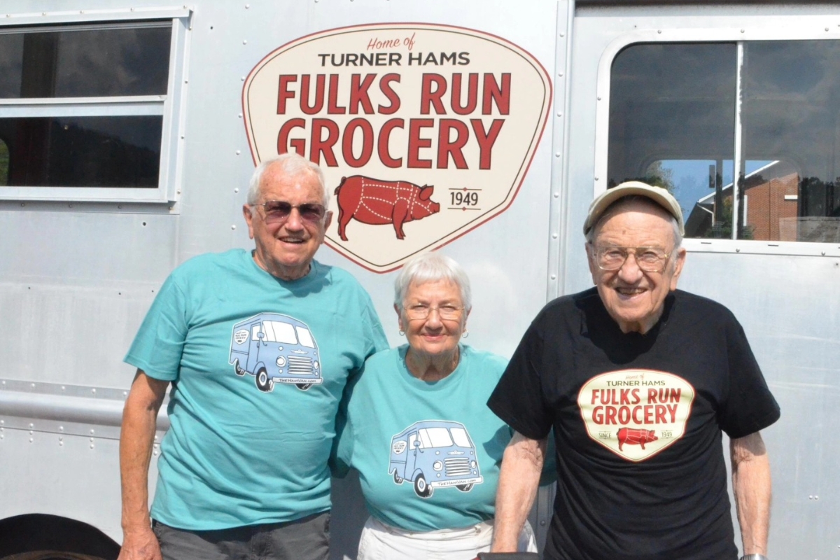 Miles, Marcella, and Miles' brother Garnett (original owner of Fulks Run Grocery) in 2018 after the unveiling of the new logo and the Ham Van.