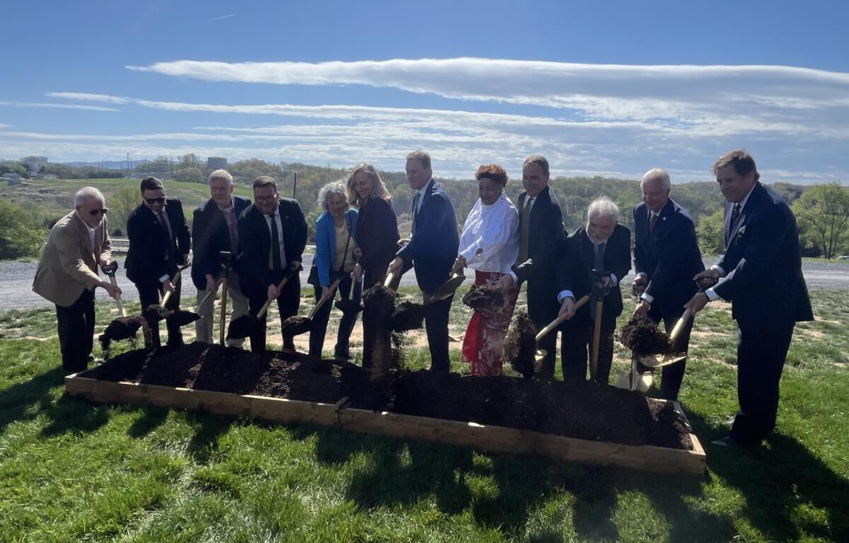 Officials dig the dirt at the official I-81 widening site in Harrisonburg.