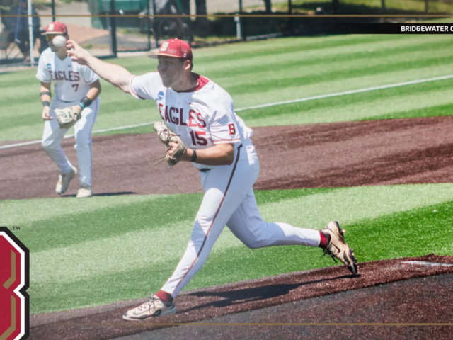 Bridgewater College Eagles pitcher on the mound delivering a pitch during a game; teammate in the background; school logo bottom left.