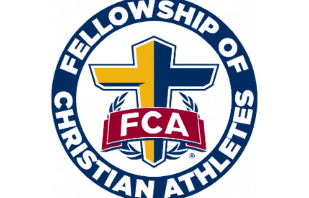 FCA logo: circular emblem with a blue-and-yellow cross, laurel leaves, and a red FCA banner, surrounding the words 'Fellowship of Christian Athletes'.