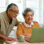 An older couple on their laptop talking to family members