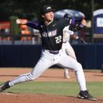 Baseball pitcher in a black jersey with OVU logo delivering a pitch from the mound.