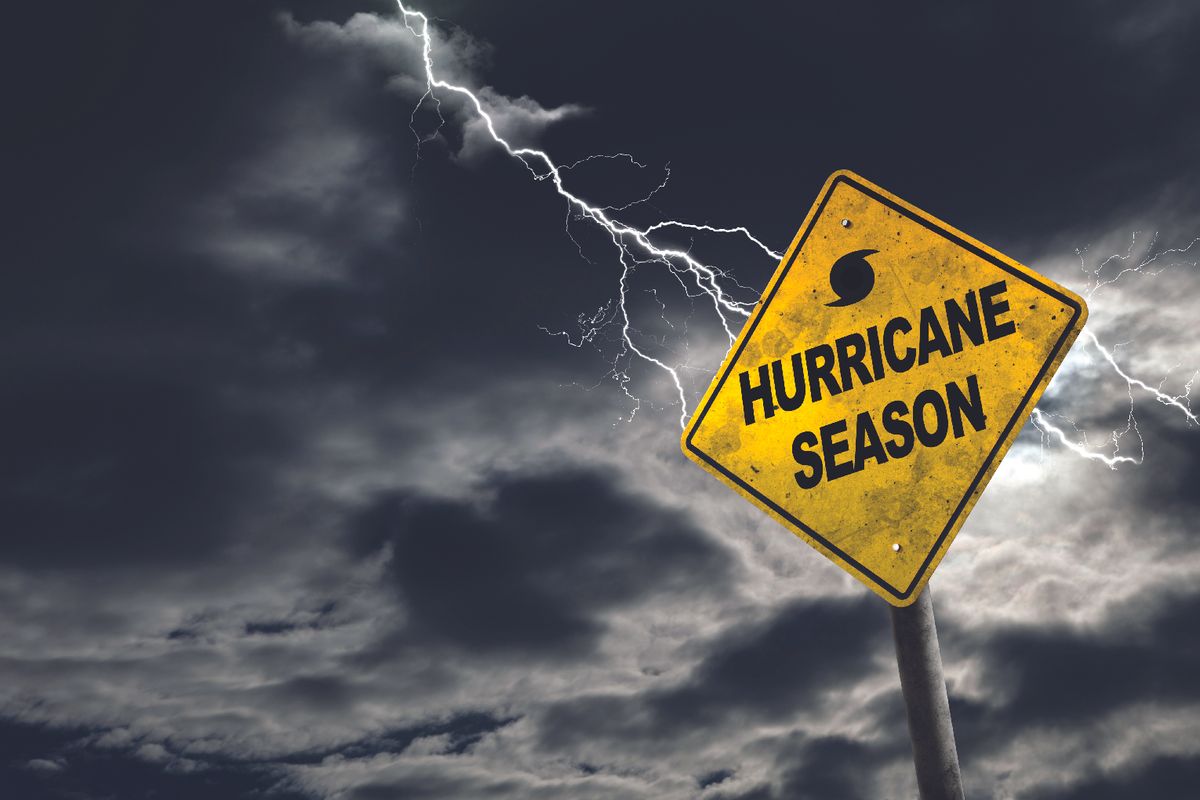 Hurricane season sign with storm clouds in the background
