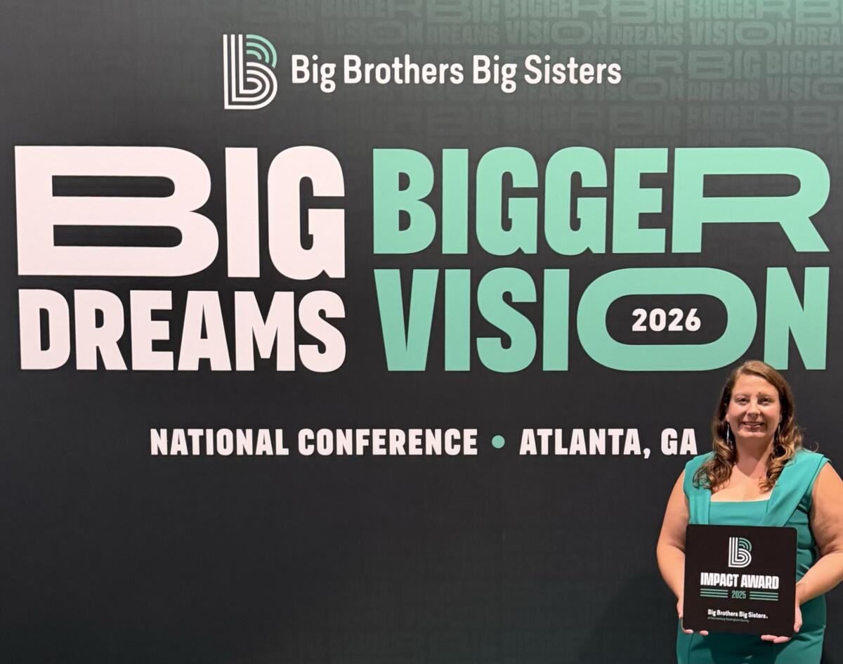 Executive Director Lindsey Douglas with 2025 Impact Award