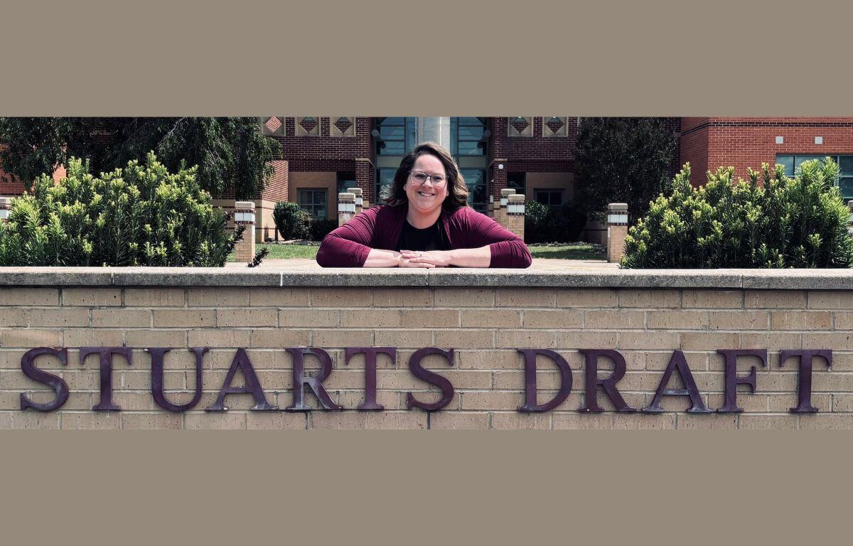 Lauren Brenneman posing next to the Stuarts Draft Elementary School sign