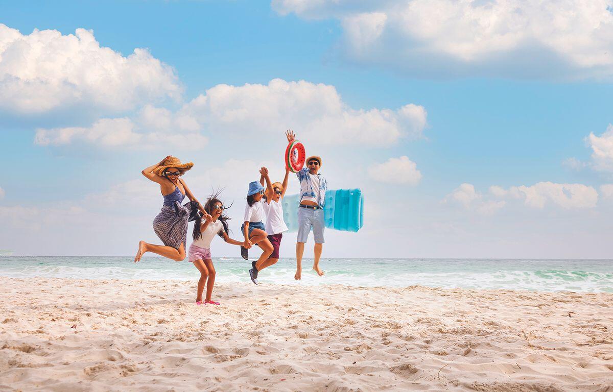Family of four on the beach