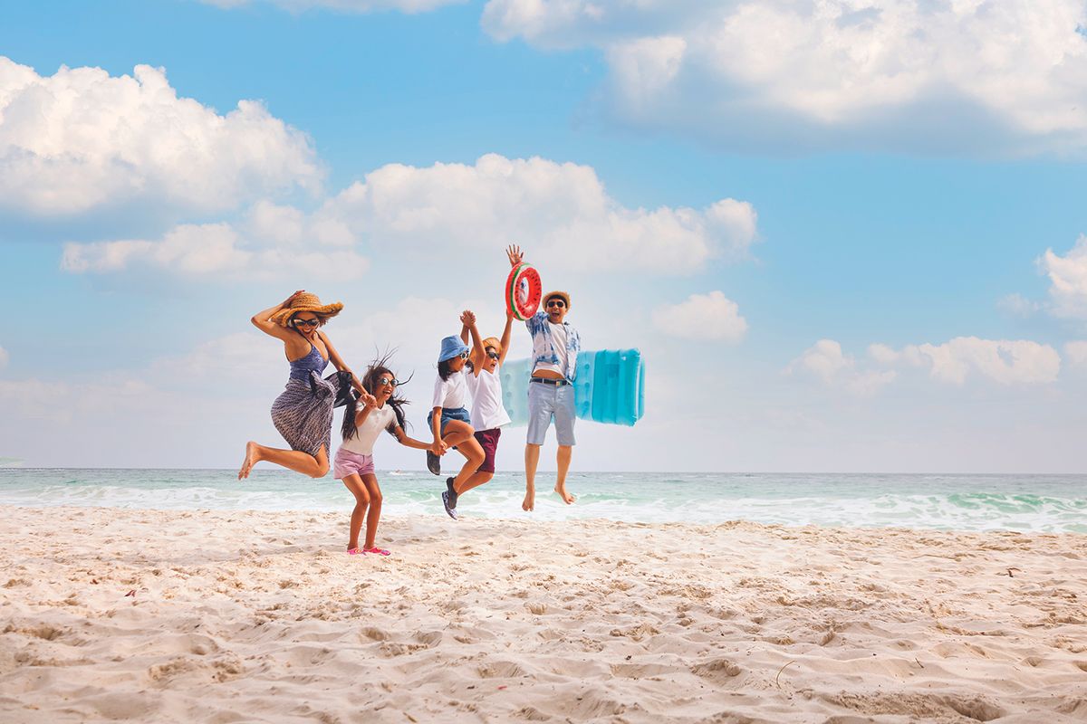 Family of four on the beach