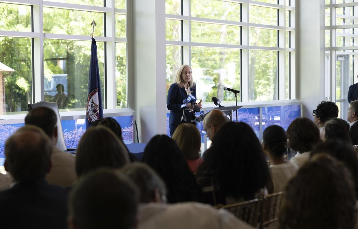 Governor Abigail Spanberger stands at a podium