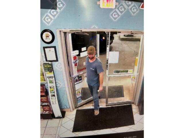 Man entering a gas station