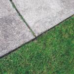 Sidewalk with grass nearby