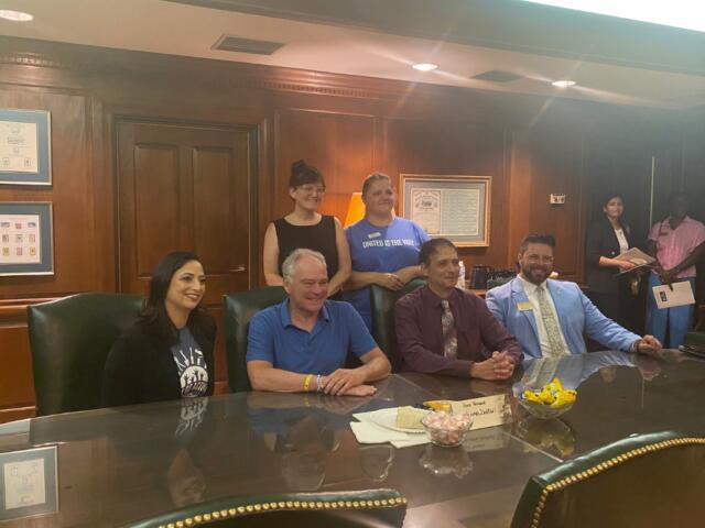 Senator Tim Kaine sits with United Way of the Central Shenandoah Valley board members and employees.