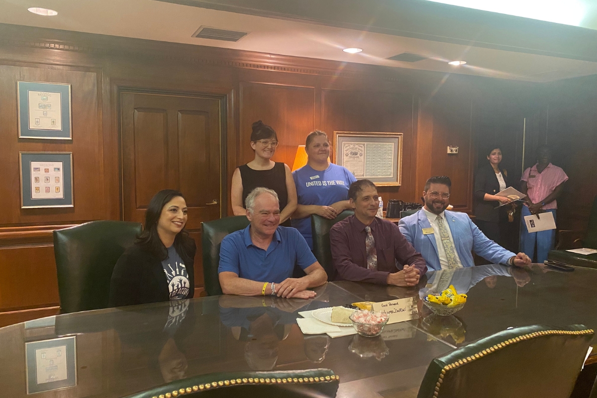 Senator Tim Kaine sits with United Way of the Central Shenandoah Valley board members and employees.