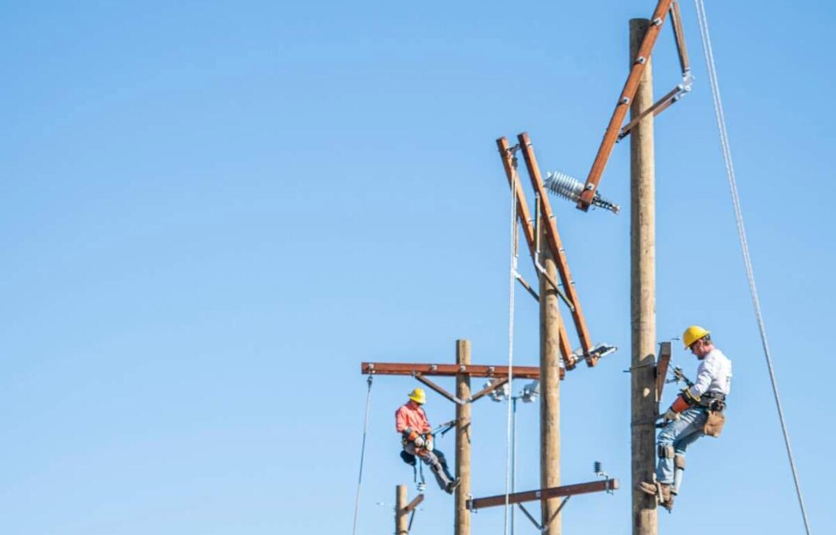 men working on electrical lines