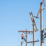men working on electrical lines