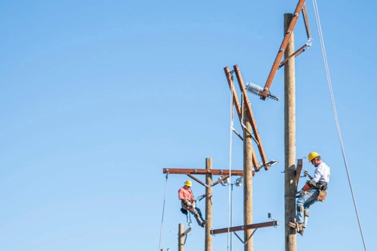 men working on electrical lines