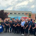 Governor Abigail Spanberger posing with Harrisonburg Police Officers