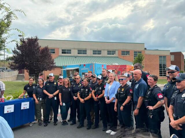 Governor Abigail Spanberger posing with Harrisonburg Police Officers