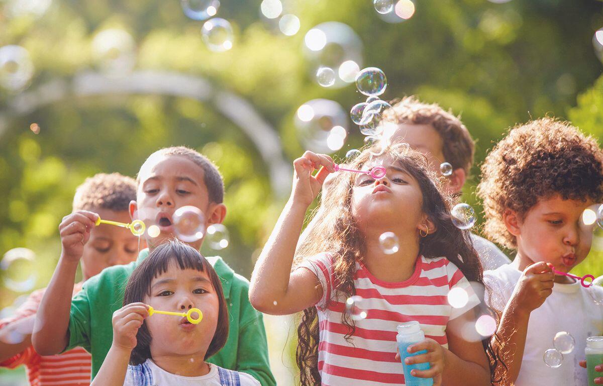 Children blowing bubbles
