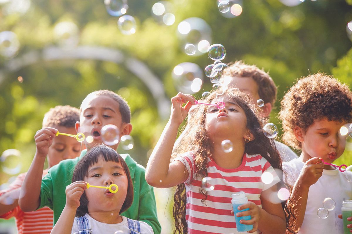 Children blowing bubbles