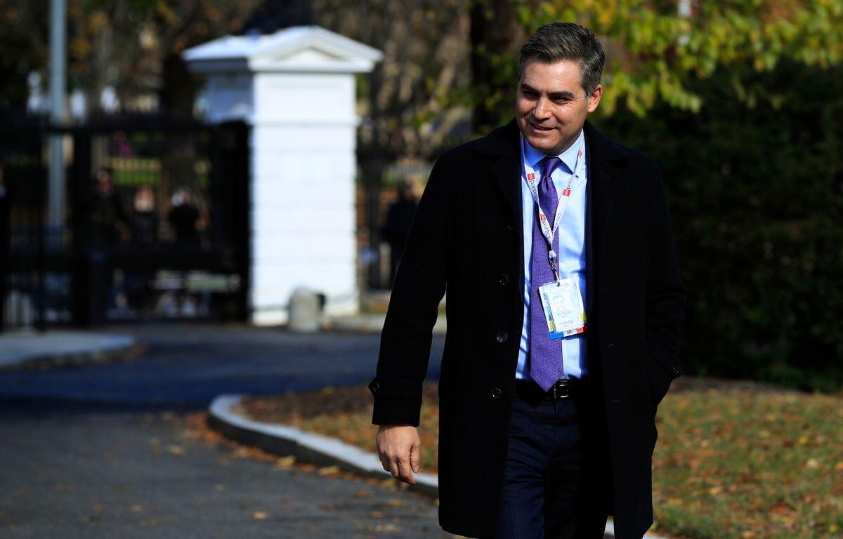 Jim Acosta walking on the North Lawn driveway upon returning back to the White House in Washington, Friday, November 16, 2018.