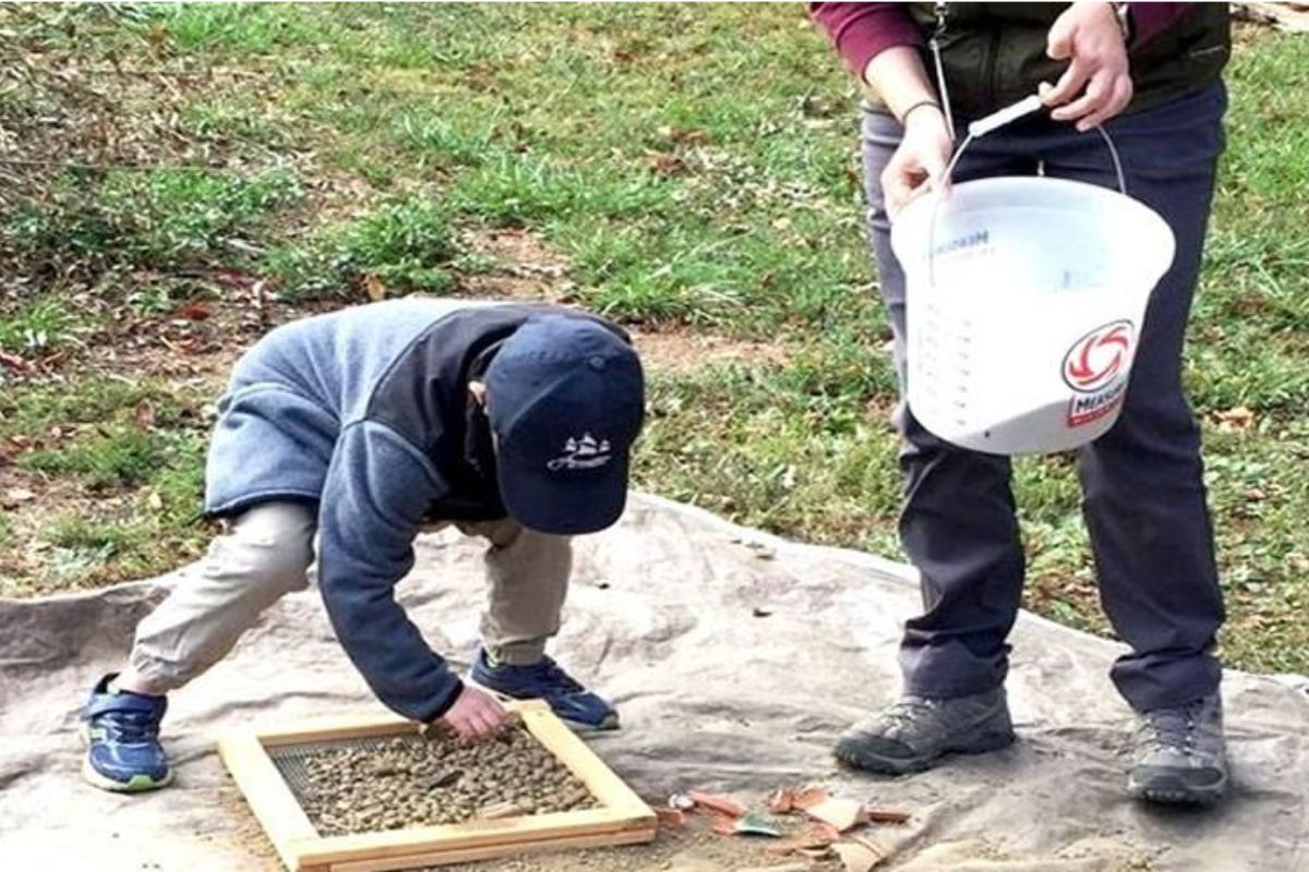 Child participating in International Archaeology Day
