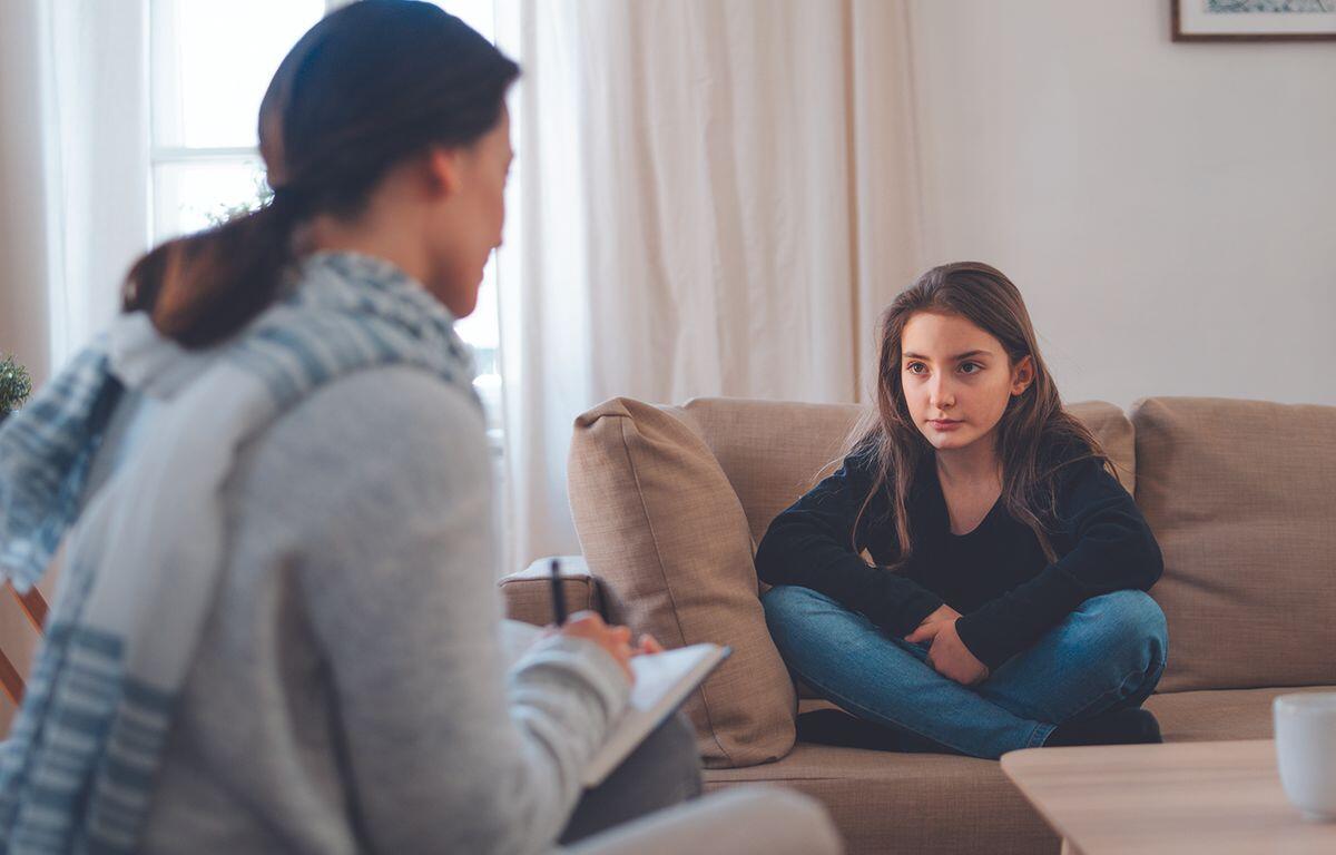 Child and counselor talking