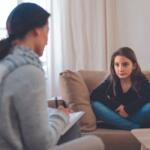Child and counselor talking