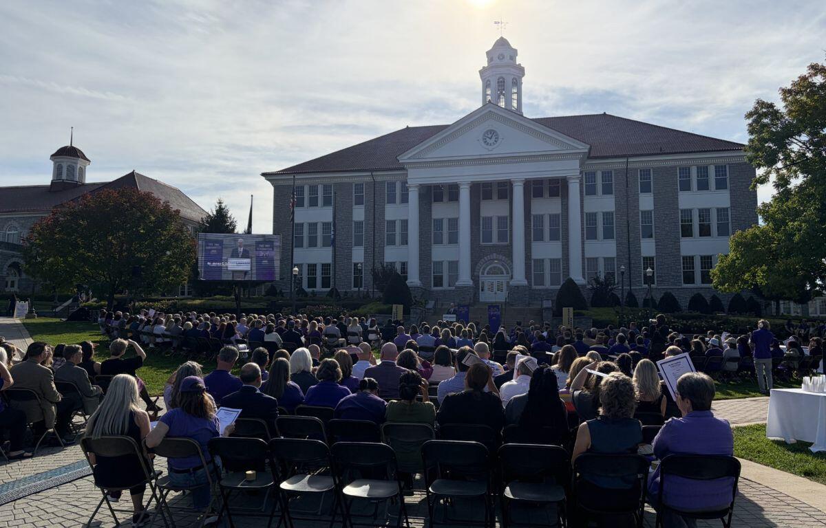 JMU President Jim Schmidt outside of Wilson Hall with a crowd
