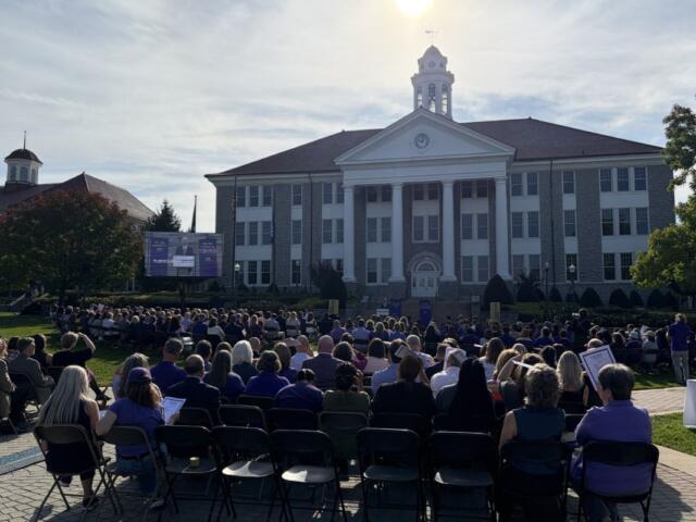 JMU President Jim Schmidt outside of Wilson Hall with a crowd