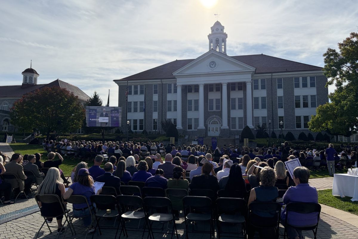 JMU President Jim Schmidt outside of Wilson Hall with a crowd